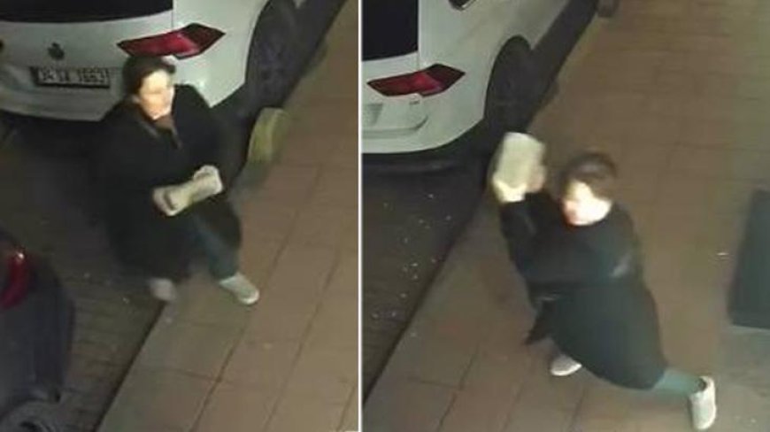 Kaldırım taşıyla öfke saçtı! Gece yarısı iş yerinin önüne gelen kadın camları tuzla buz etti